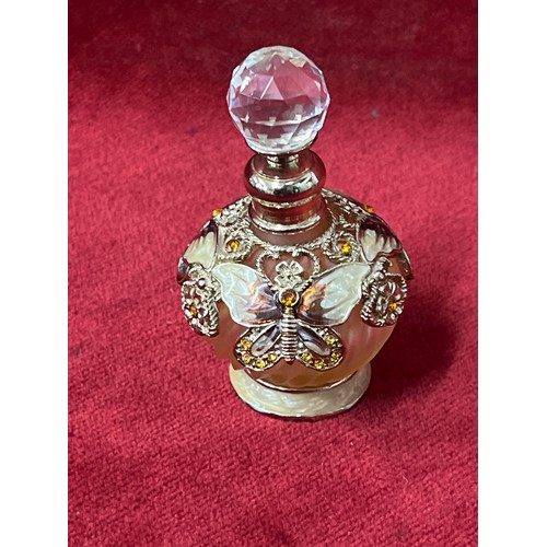 1 - 4 VERY DECORATIVE PERFUME BOTTLES WITH ENAMEL AND COLOURED GLASS DETAIL. INCLUDES A DRAGONFLY AND BU... 