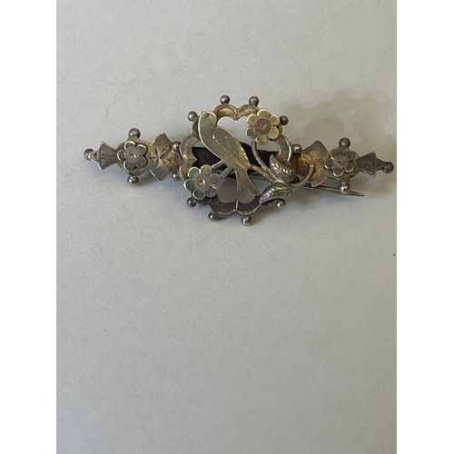 35C - A SILVER BROOCH WITH FLOWERS AND A LITTLE BIRD BIRMINGHAM 1904 BY H&W