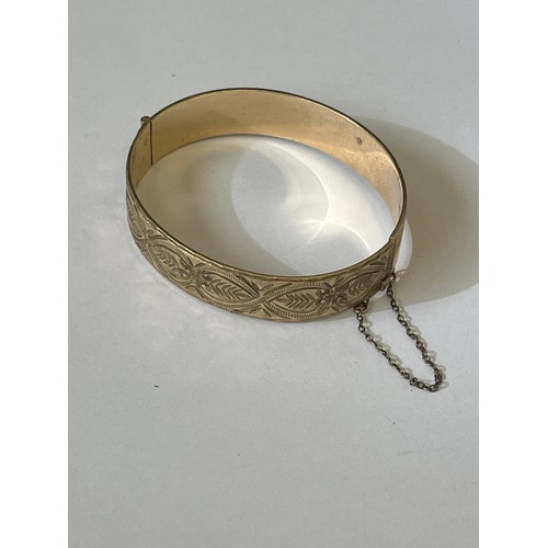 52 - A LOVELY BANGLE GOLD PLATED WITH CARVED PATTERN