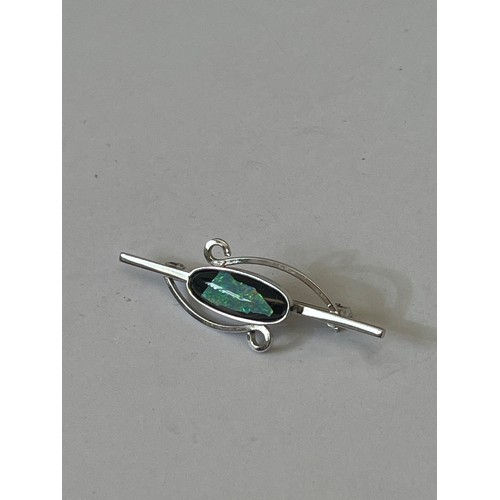 33D - A NEW SILVER BROOCH WITH A FIRE OPAL ON BLACK BACK GROUND