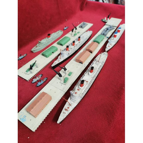 135 - TRIANG MINIC, DOCKS, WAREHOUSING AND CRANES PLAY SET INCLDING 4 OCEAN LINERS 4 TUG BOATS AND MORE.