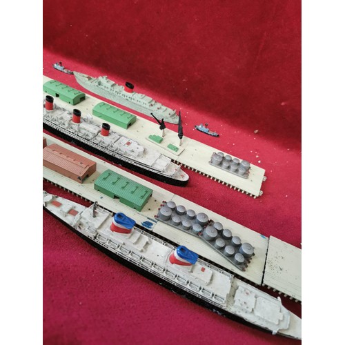 135 - TRIANG MINIC, DOCKS, WAREHOUSING AND CRANES PLAY SET INCLDING 4 OCEAN LINERS 4 TUG BOATS AND MORE.