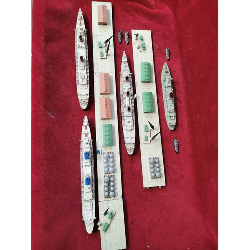 135 - TRIANG MINIC, DOCKS, WAREHOUSING AND CRANES PLAY SET INCLDING 4 OCEAN LINERS 4 TUG BOATS AND MORE.