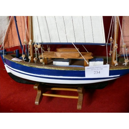 234 - MODEL OF A YACHT ON WOODEN STAND