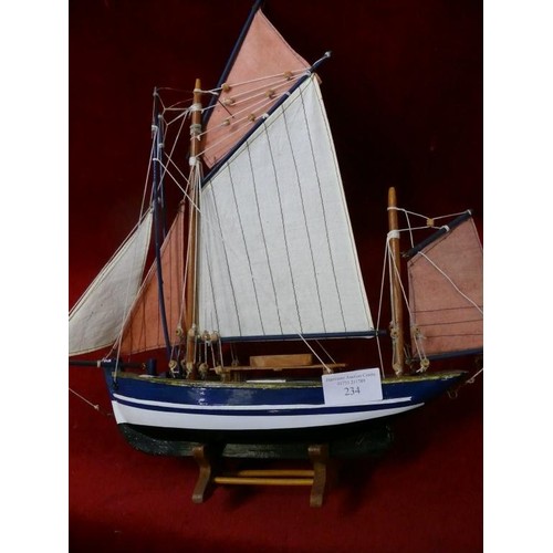 234 - MODEL OF A YACHT ON WOODEN STAND