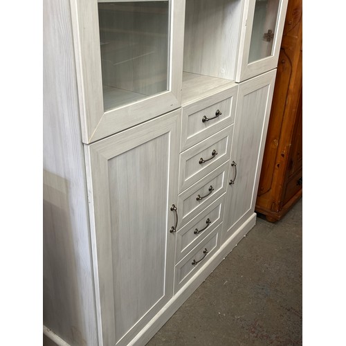 367 - LIMEWASH DISPLAY CABINET WTH GLAZED DOORS AND OPEN SHELVES TO TOP PLUS 5 DRAWERS AND 2 CUPBOARDS BEL... 