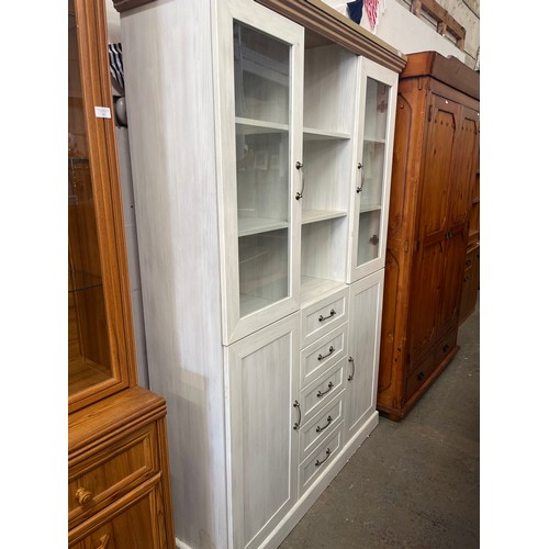 367 - LIMEWASH DISPLAY CABINET WTH GLAZED DOORS AND OPEN SHELVES TO TOP PLUS 5 DRAWERS AND 2 CUPBOARDS BEL... 