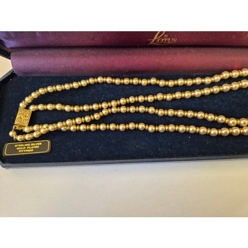 27 - A STRING OF LOTUS CLASSIC PEARLS WITH STERLING SILVER AND GOLD PLATED FITTINGS