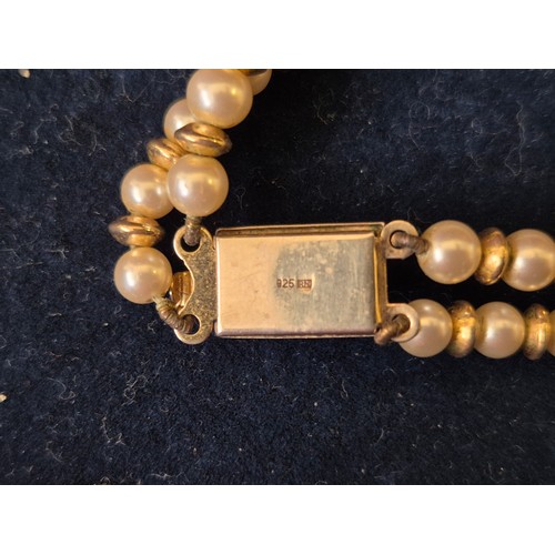 27 - A STRING OF LOTUS CLASSIC PEARLS WITH STERLING SILVER AND GOLD PLATED FITTINGS