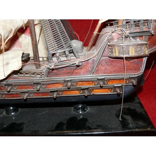 65 - WOODEN MODEL OF A GALLEON ON STAND