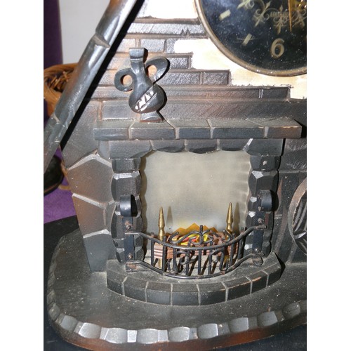 116 - WOODEN COTTAGE CLOCK WITH LIGHT UP FIRE BY PRESIDENT HOME FIRE