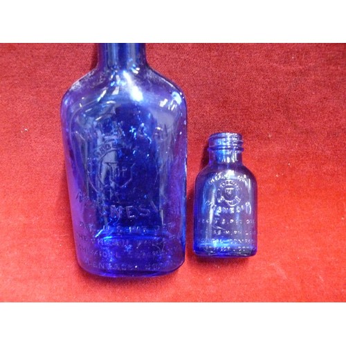 52 - SLIPPER BED PAN TOGETHER WITH TWO MILK OF MAGNESIA BLUE BOTTLES & AN ANTIQUE MINIM MEASURE IN LEATHE... 