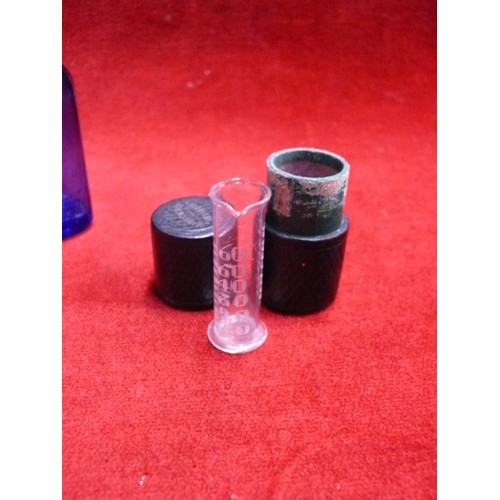 52 - SLIPPER BED PAN TOGETHER WITH TWO MILK OF MAGNESIA BLUE BOTTLES & AN ANTIQUE MINIM MEASURE IN LEATHE... 