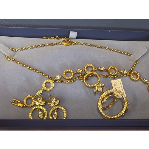 47 - BOXED GOLD COLOURED JEWELLERY SET WITH NECKLACE, BRACELET AND EARRINGS
