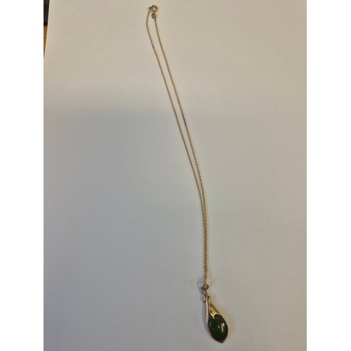 52 - A 9CT GOLD AND JADE PENDANT ON GOLD CHAIN 3.20GR
