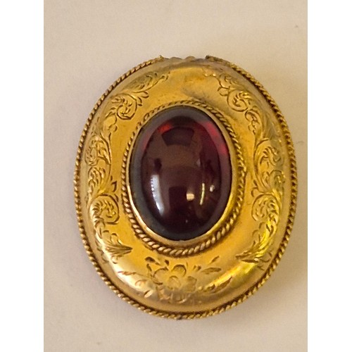 47 - A MOURNING PENDANT IN 14CT GOLD WITH RED STONE AND HAIR IN THE BACK WIEGHT 3.81GR TESTED ONLY NEEDS ... 