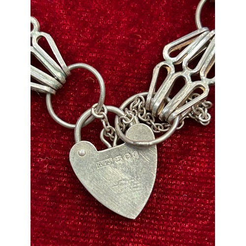37 - AN ENGLISH HALLMARKED STERLING SILVER GATE BRACELET WITH HEART CLASP AND AN ANTIQUE 