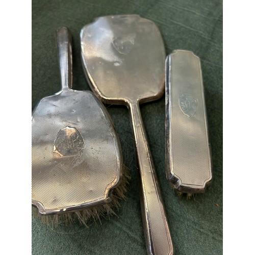 10 - STERLING SILVER 3 PIECE DRESSING TABLE SET OF MIRROR AND 2 BRUSHES. ENGINE TURNED DECORATION WITH 