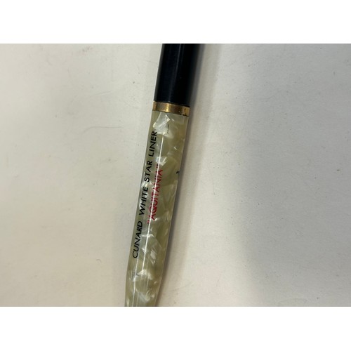 31 - A Platignum fountain pen with 14ct gold nib and a vintage Cunard White Star Line “Aquitania” pencil.