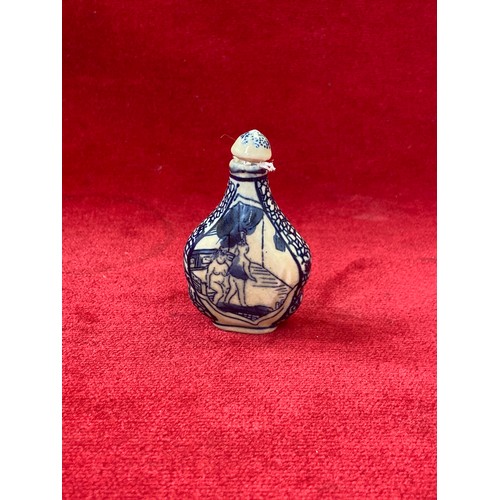 46 - Chinese porcelain blue and white snuff bottle, decorated with erotic scenes on each side and complet... 