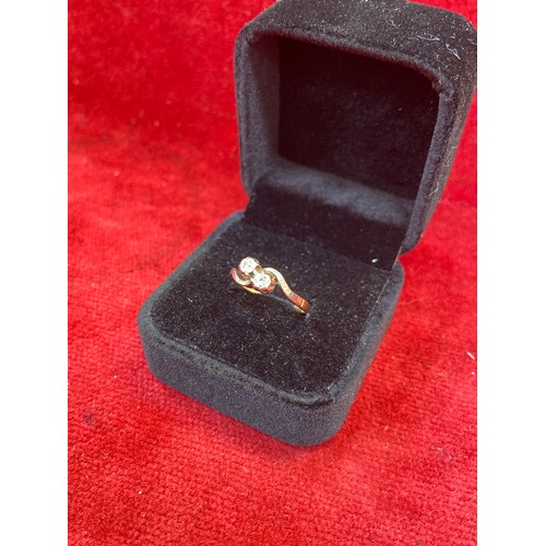 64 - A Vintage 18ct gold ring in crossover design platinum setting with two diamonds. Size L 2.2 grams