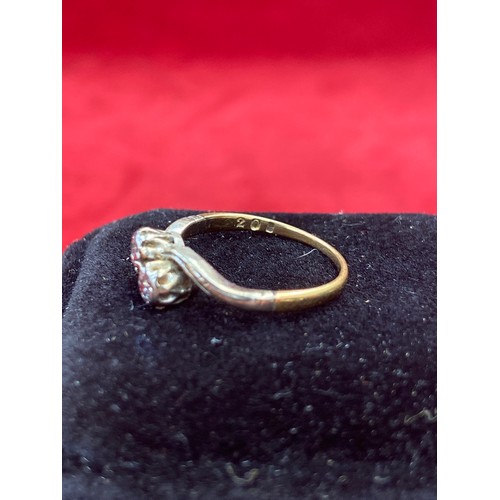 64 - A Vintage 18ct gold ring in crossover design platinum setting with two diamonds. Size L 2.2 grams
