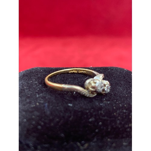 64 - A Vintage 18ct gold ring in crossover design platinum setting with two diamonds. Size L 2.2 grams