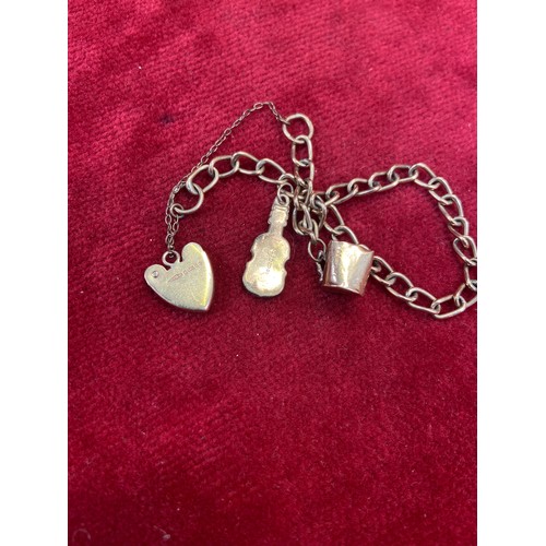 66 - A vintage 9ct gold charm bracelet, London hallmarks, with jug & fiddle charms  - all English hallmar... 