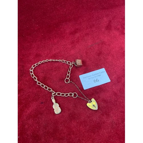 66 - A vintage 9ct gold charm bracelet, London hallmarks, with jug & fiddle charms  - all English hallmar... 