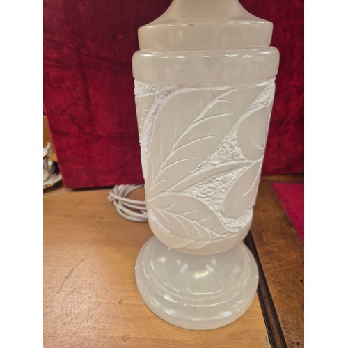 115 - Large alabaster table lamp, carved with art nouveau floral details around the cylinder shade and ste... 