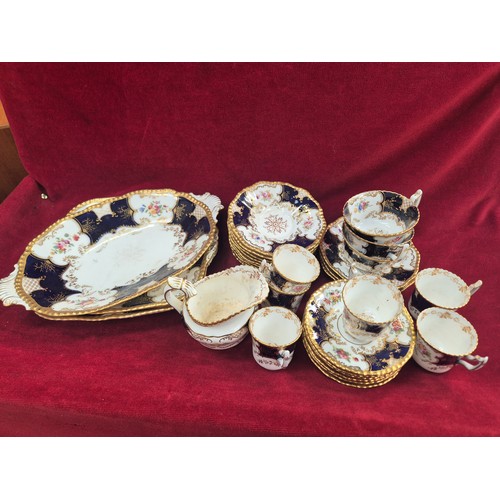 117 - Coalport bone china 'Batwing' pattern tea set, with the distinctive cobalt blue, gilt and floral dec... 