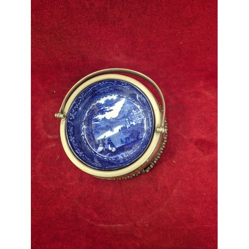 131 - A Victorian flow blue 'Jenny Lind' dish in an oak and E.P.N.S. swing handled table coaster/holder.
T... 