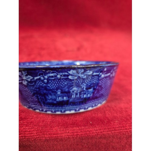 131 - A Victorian flow blue 'Jenny Lind' dish in an oak and E.P.N.S. swing handled table coaster/holder.
T... 