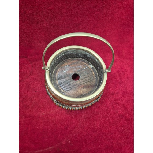 131 - A Victorian flow blue 'Jenny Lind' dish in an oak and E.P.N.S. swing handled table coaster/holder.
T... 