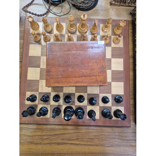 136 - Vintage Staunton Chessmen boxwood chess set, in the original wooden box with remnants of label insid... 
