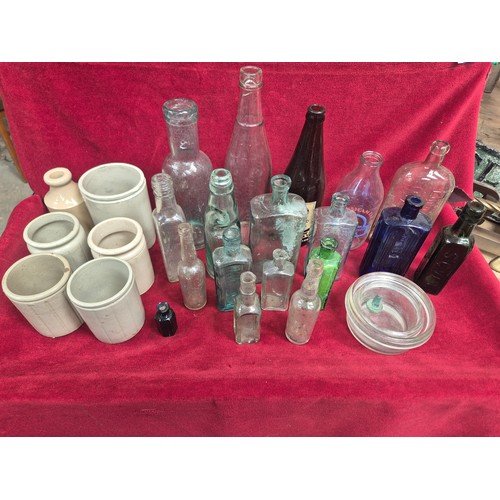 151 - Group of Victorian and early 20thC glass bottles and stoneware preserve pots, including ribbed poiso... 