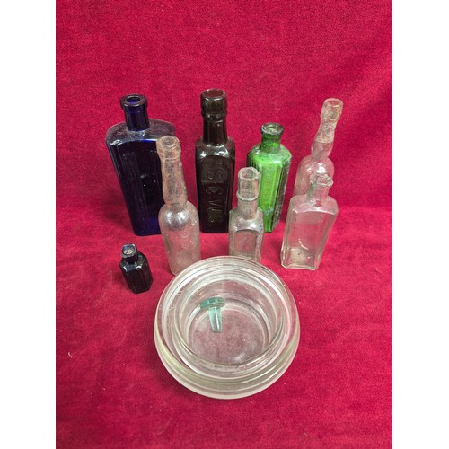 151 - Group of Victorian and early 20thC glass bottles and stoneware preserve pots, including ribbed poiso... 