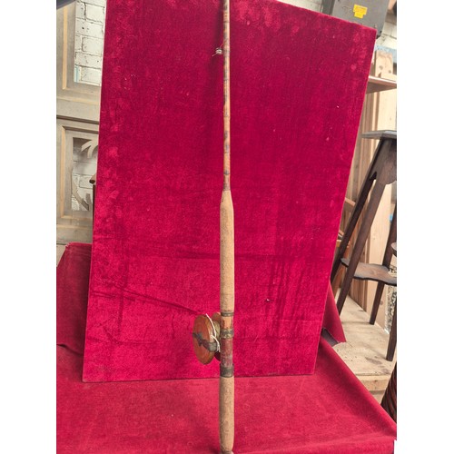 156 - Vintage bamboo cane fishing rod, complete with a wooden reel.