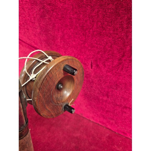 156 - Vintage bamboo cane fishing rod, complete with a wooden reel.