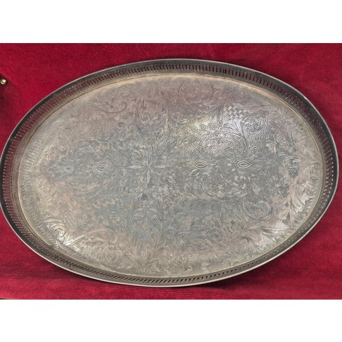 133 - Vintage silver plated oval serving tray, with foliate chased engraving and pierced gallery. 45cm x 3... 