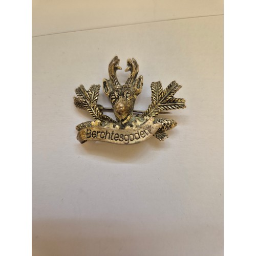 81 - Small collection of vintage badges including The Queens Bays cap badge, Austrian souvenir badges, pr... 