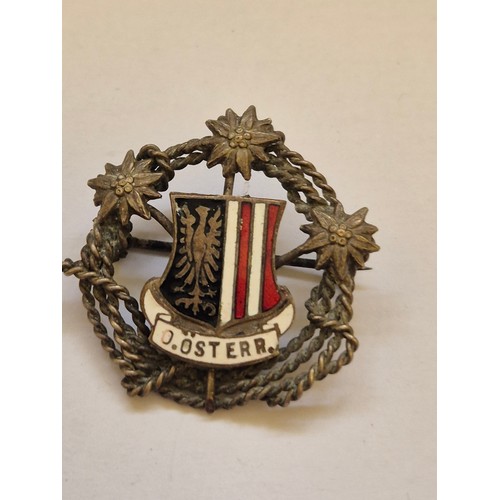 81 - Small collection of vintage badges including The Queens Bays cap badge, Austrian souvenir badges, pr... 