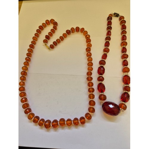 85 - Two circa 1930s faceted amber and glass bead necklaces with barrel clasps. Several of the beads with... 