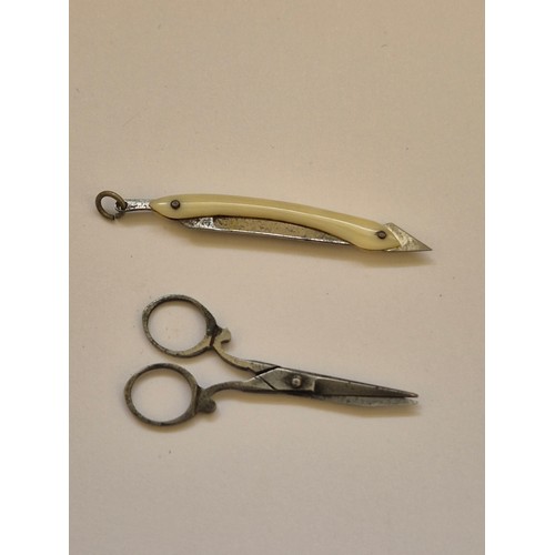 94 - A sweet pair of miniature Victorian scissors, together with a miniature folding cutthroat razor, in ... 