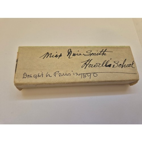 94 - A sweet pair of miniature Victorian scissors, together with a miniature folding cutthroat razor, in ... 