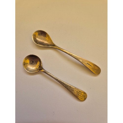 93 - Two sterling silver mustard/salt spoons, one hallmarked for Birmingham 1922, one for Sheffield 2002.