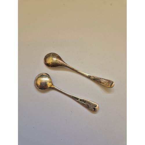 93 - Two sterling silver mustard/salt spoons, one hallmarked for Birmingham 1922, one for Sheffield 2002.