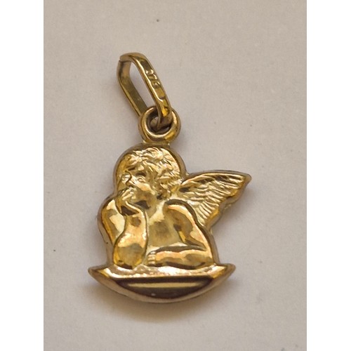 92 - A 375 (9ct) gold pendant charm of a cherub resting his chin on his palm, together with a diamond sha... 