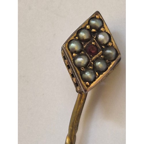 92 - A 375 (9ct) gold pendant charm of a cherub resting his chin on his palm, together with a diamond sha... 