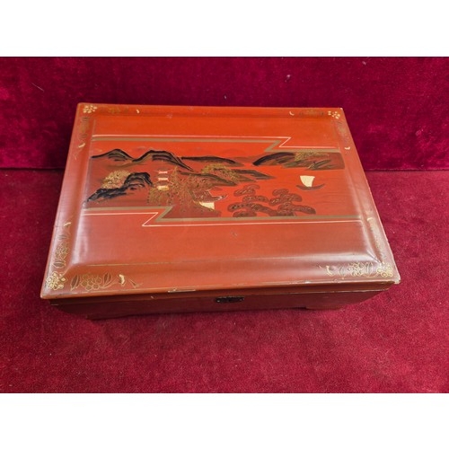 87 - 1930s Japanese lacquered jewellery box with contents of costume jewellery, 2 porcelain pincushion do... 